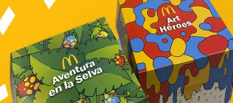 Dues caixes de McDonalds que tenen diferents temes, una d'una selva i l'altra de pintura de colors vius